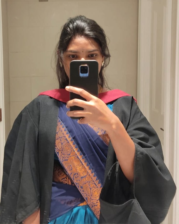 Sudha in her University of Bristol graduation gown and hood